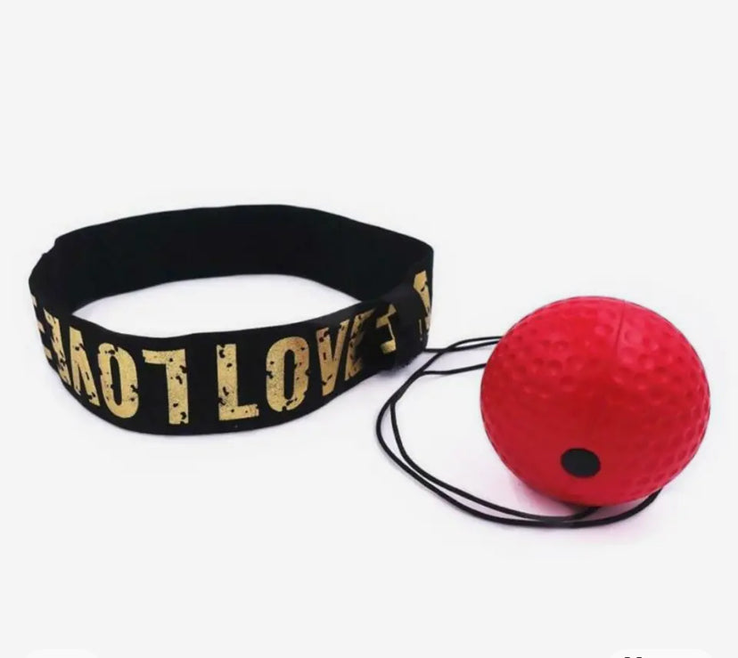 Accessoire coordination pour boxeurs avec élastique noir et balle rouge pour améliorer la vitesse et la réactivité